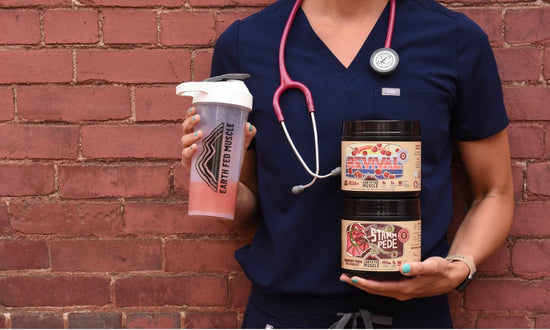 Medical Professional holding Earth Fed Muscle pre-workout